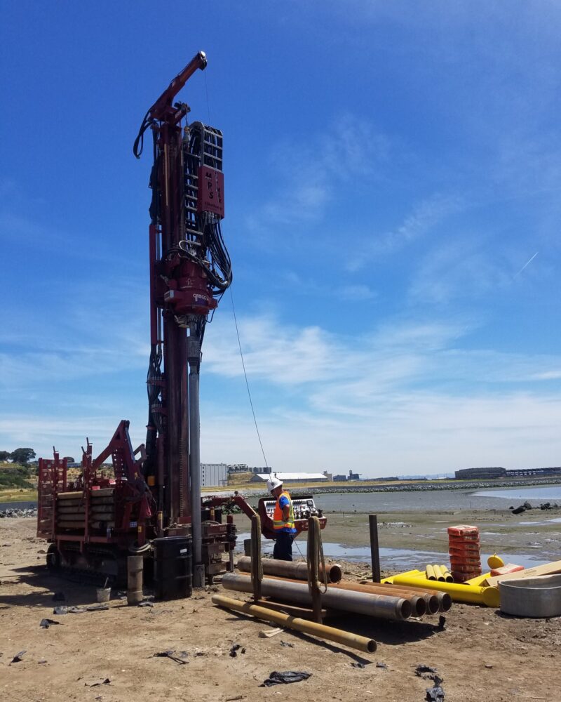 20190610_WellInstall_HP Tall drilling tube equipment with person next to it