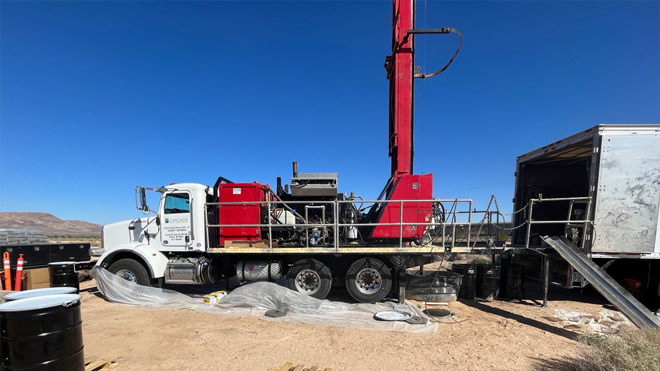 large truck with equipment on the back bed